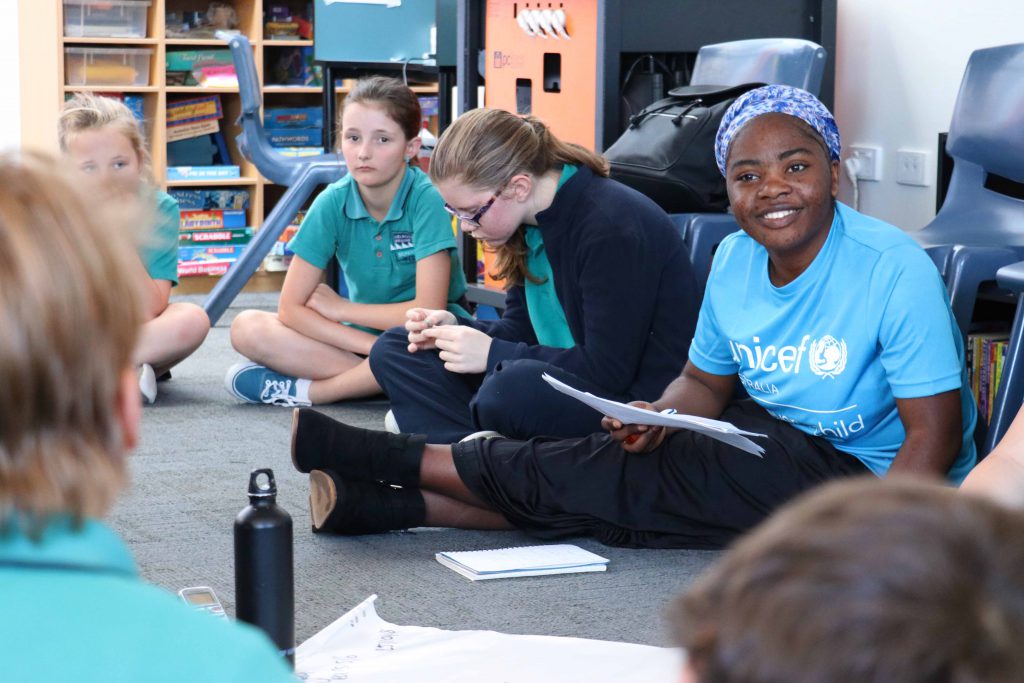 Year 11 student Atosha Birongo speaking with Melrose Primary School students